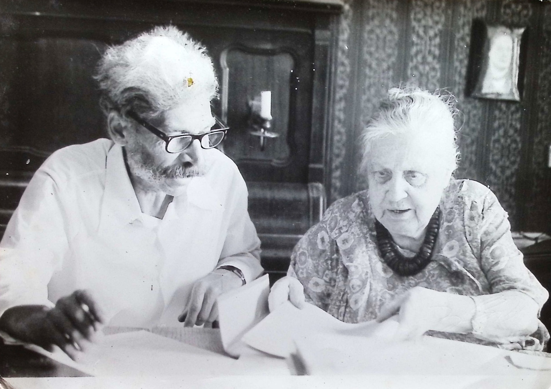 With a colleague, comparing entries.